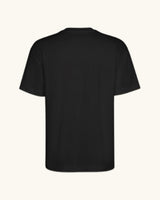 FAKE DRIVER — camiseta negro estilo motorsport, drop edición limitada, detalle del diseño | Axiom Studio